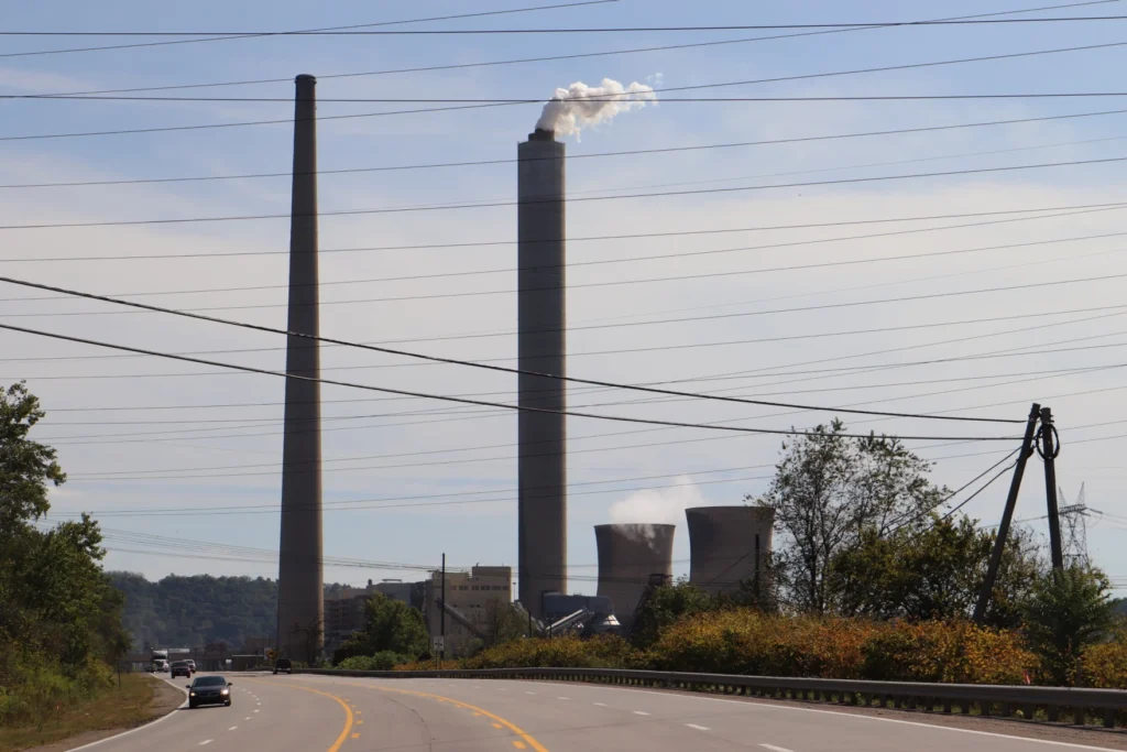 Smokestacks are seen in the distance at the Mitchell Power Plant.