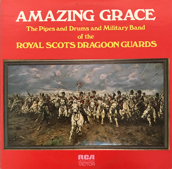 The cover of a record album. It's red with a troupe of soldiers on horses running toward the camera.