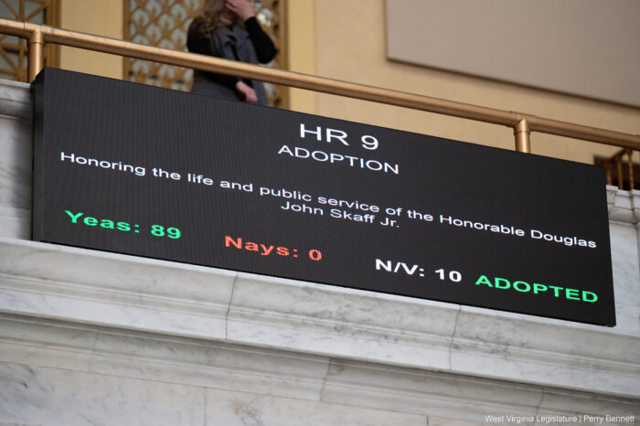 A black screen in the House of Delegates displays information about House Resolution 9