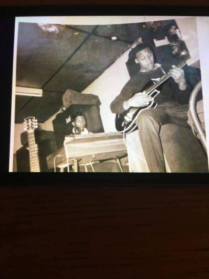 A black and white photo of two Black men playing in a band.