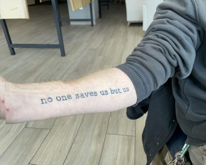 tattoo that reads no one saves us but us