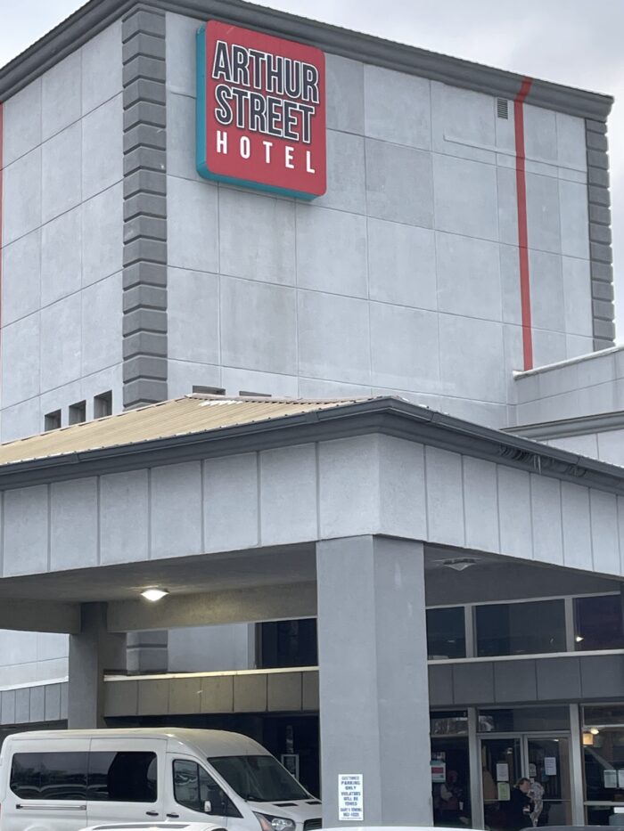 Exterior of a building that says Arthur Street Hotel