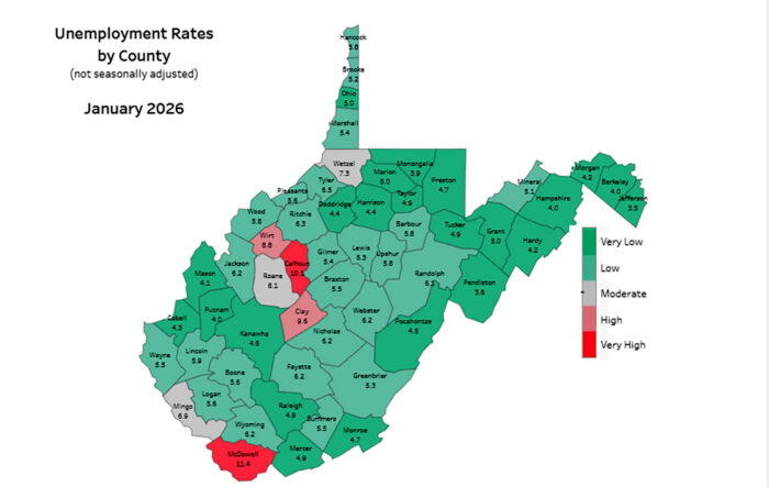 Map of West Virginia showing county outlines, most in green, a few in red.