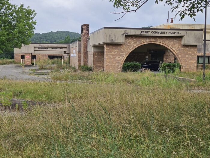 A building in the middle a field. 