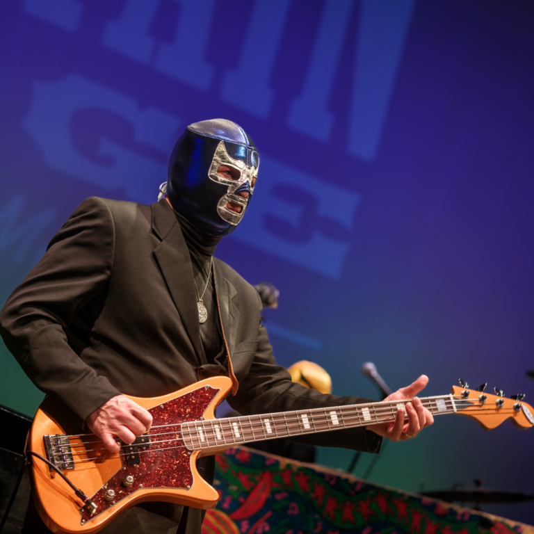 musician in wrestling mask