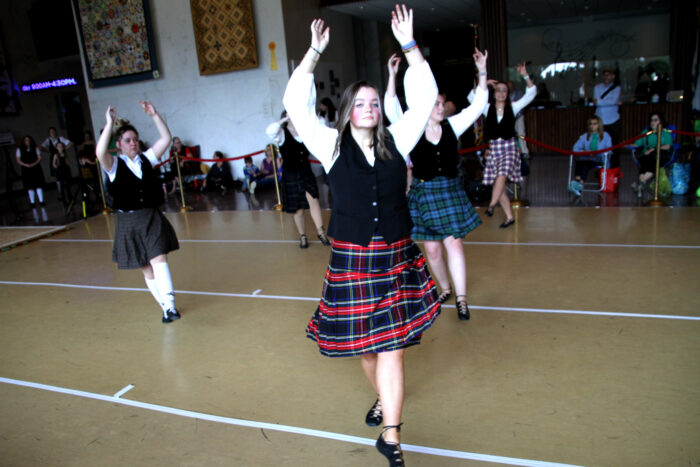Female dancers in Celtic attire perform