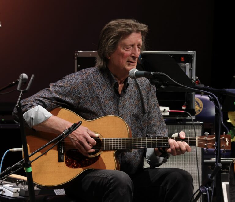man plays guitar