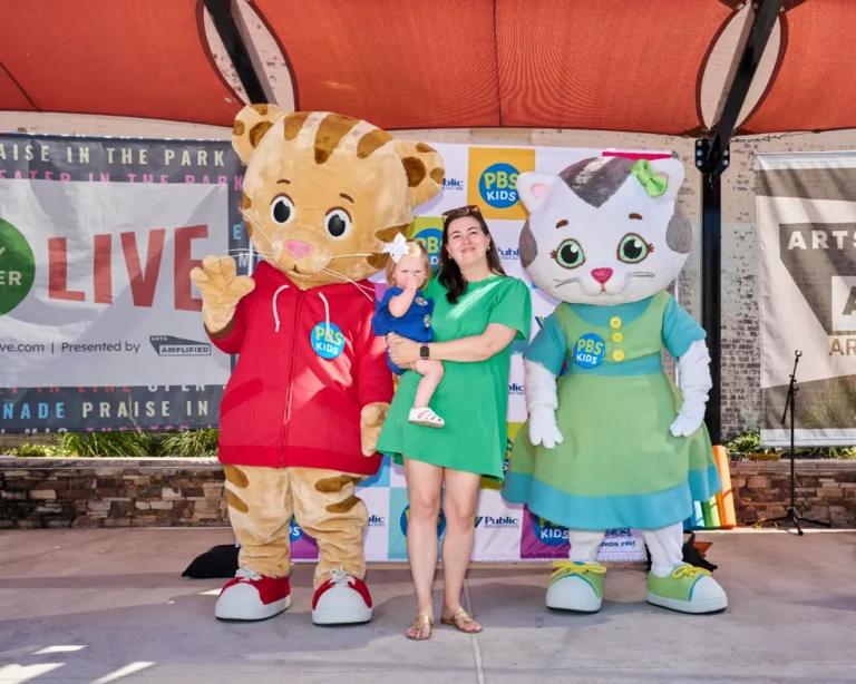 Daniel Tiger and Katerina Kittycat with a mother and her child.