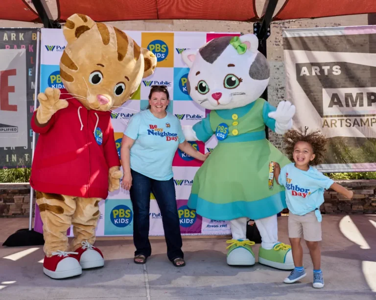 Daniel Tiger and Katerina Kittycat with a woman and a young boy.