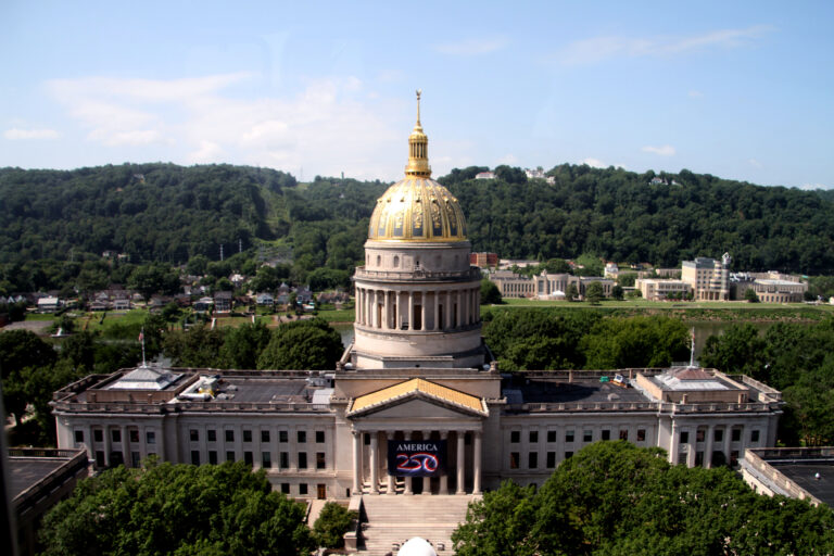 Aerial shot of the WV state capitol building with the gilded dome.