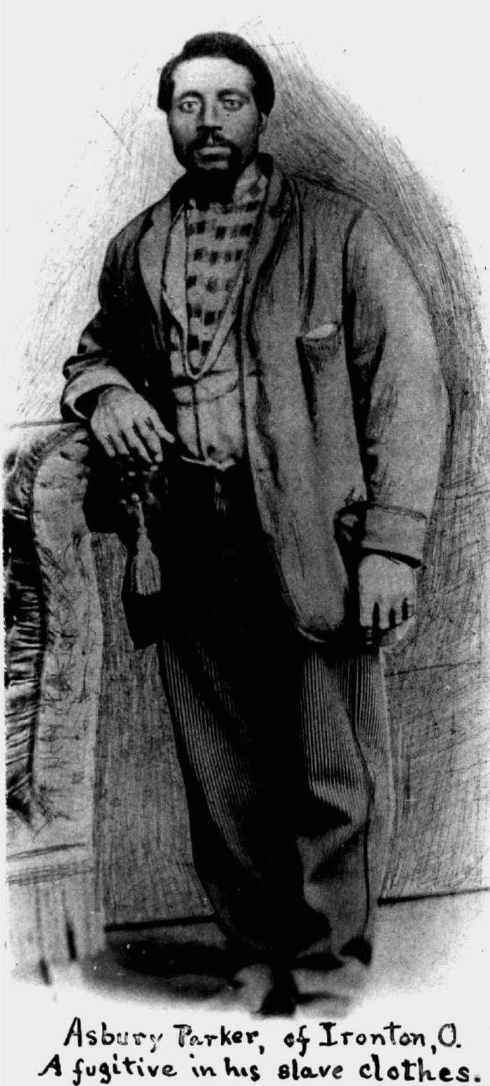 A black-and-white portrait of a man wearing a suit. 