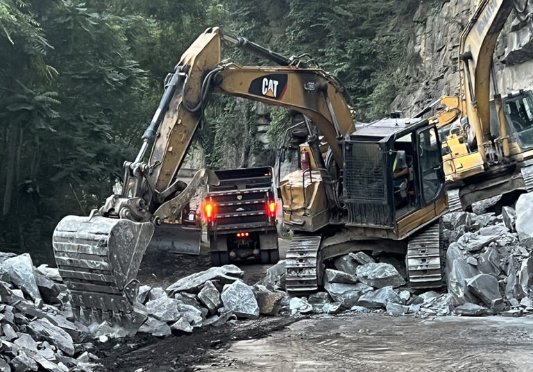 Heavy equipment moved rocks from the road