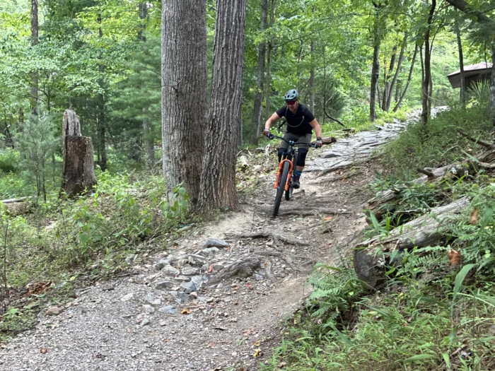 A person riding a bike on a trail. 