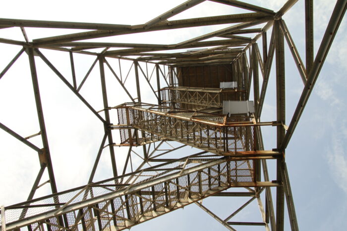 inside the tower looking up at the stairs