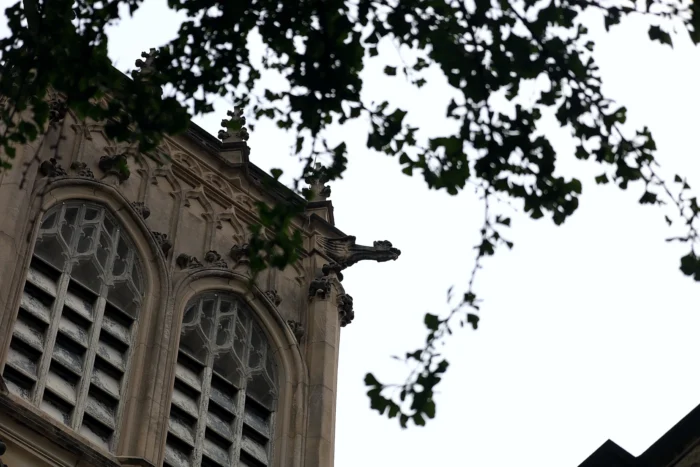 Outside a church, looking upwards toward the sky.