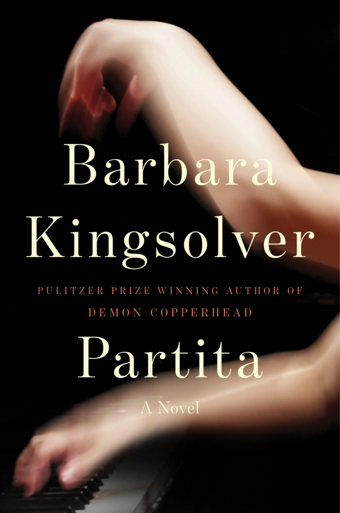 The cover of a novel. The image in the background is a white person playing piano. The text on the cover says: Barbara Kingsolver, Pulitzer Prize winning author of "Demon Copperhead." The book is called "Partita." 