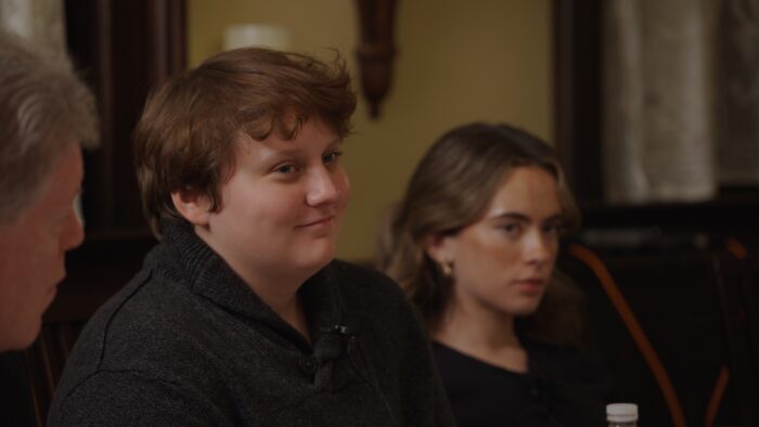 Two young women sitting at a dinner table